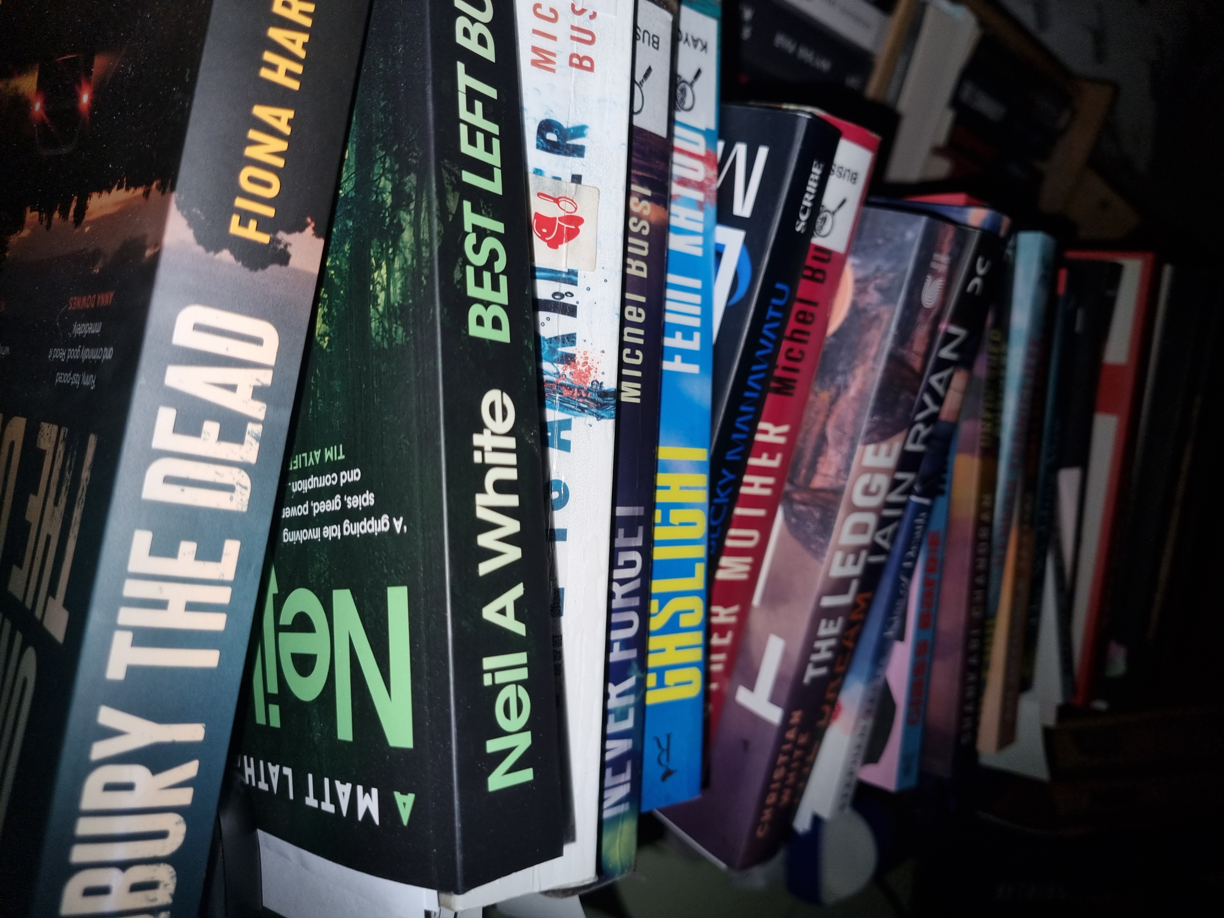 Reading stack of books looking downwards